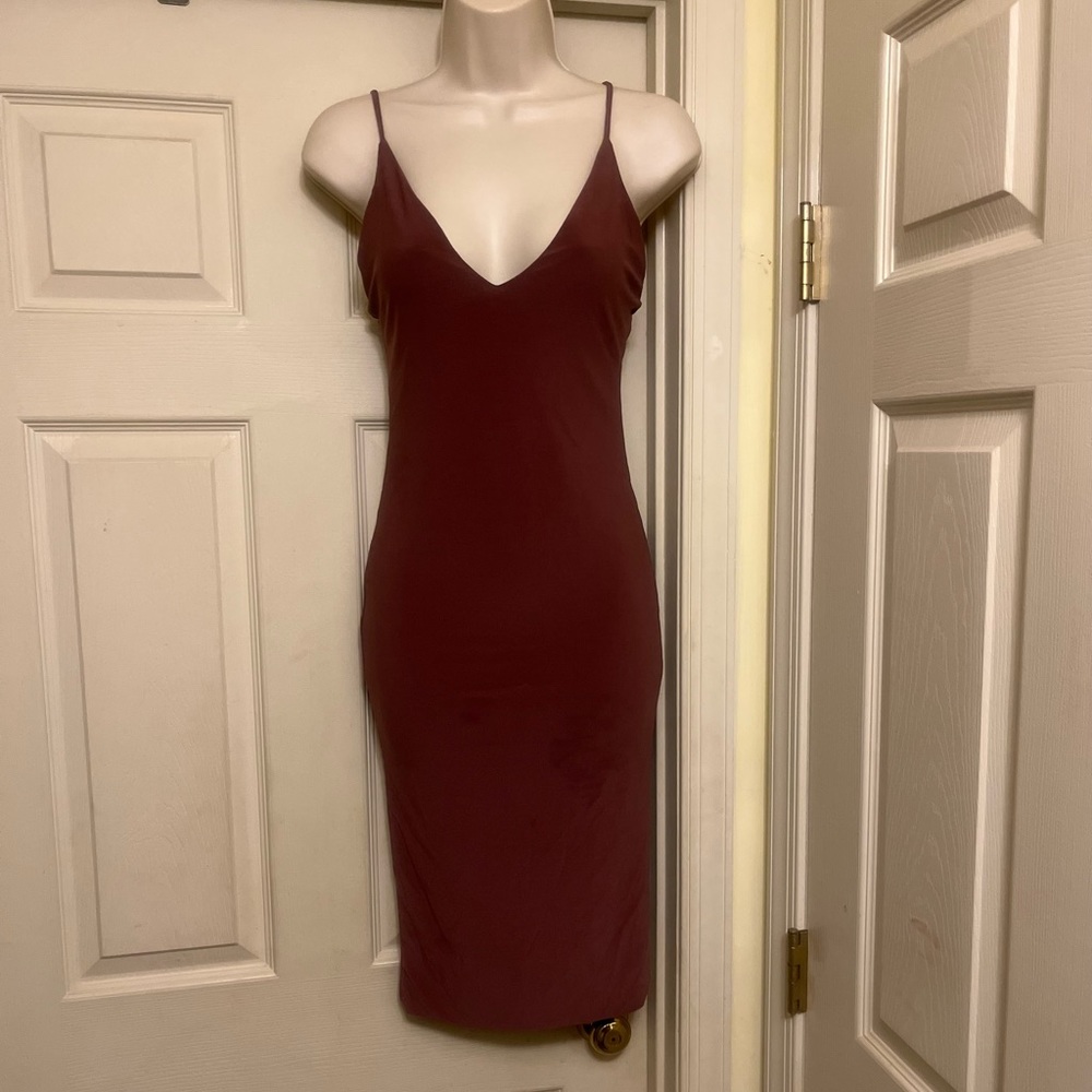 “Fashions a Dress”